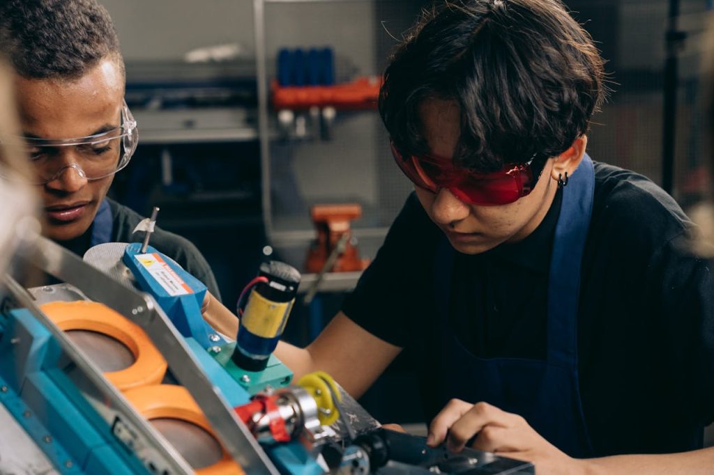 pexels-photo-9242216 Men in Goggles Working at Workshop